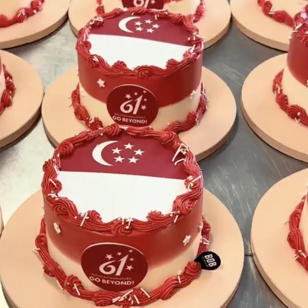 Bob the Baker Boy preparing corporate cakes for multi-location delivery in Singapore