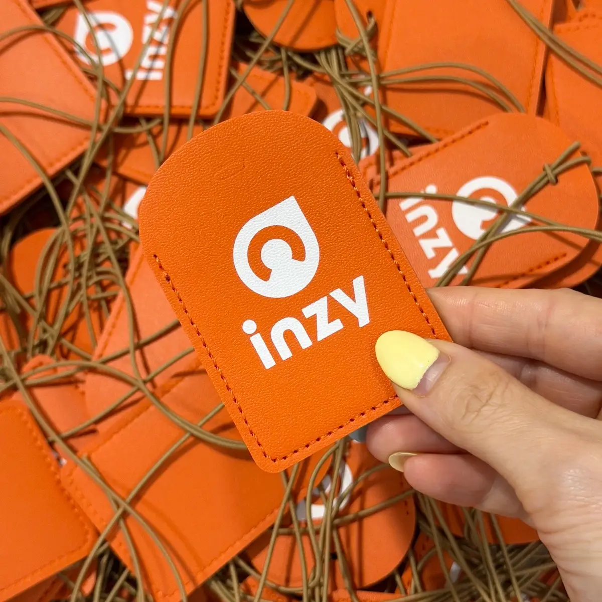 Custom Pinch Bakehouse and INZY corporate mooncake gift with orange branded luggage tag in Singapore