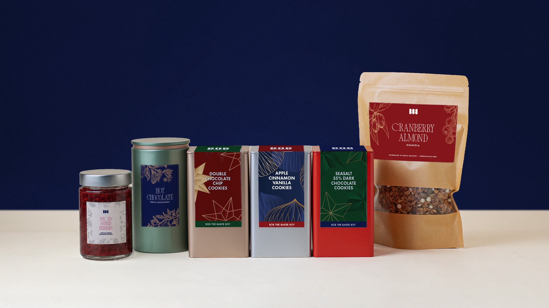 Christmas hamper items including cookies, hot chocolate, granola and jam by Bob the Baker Boy