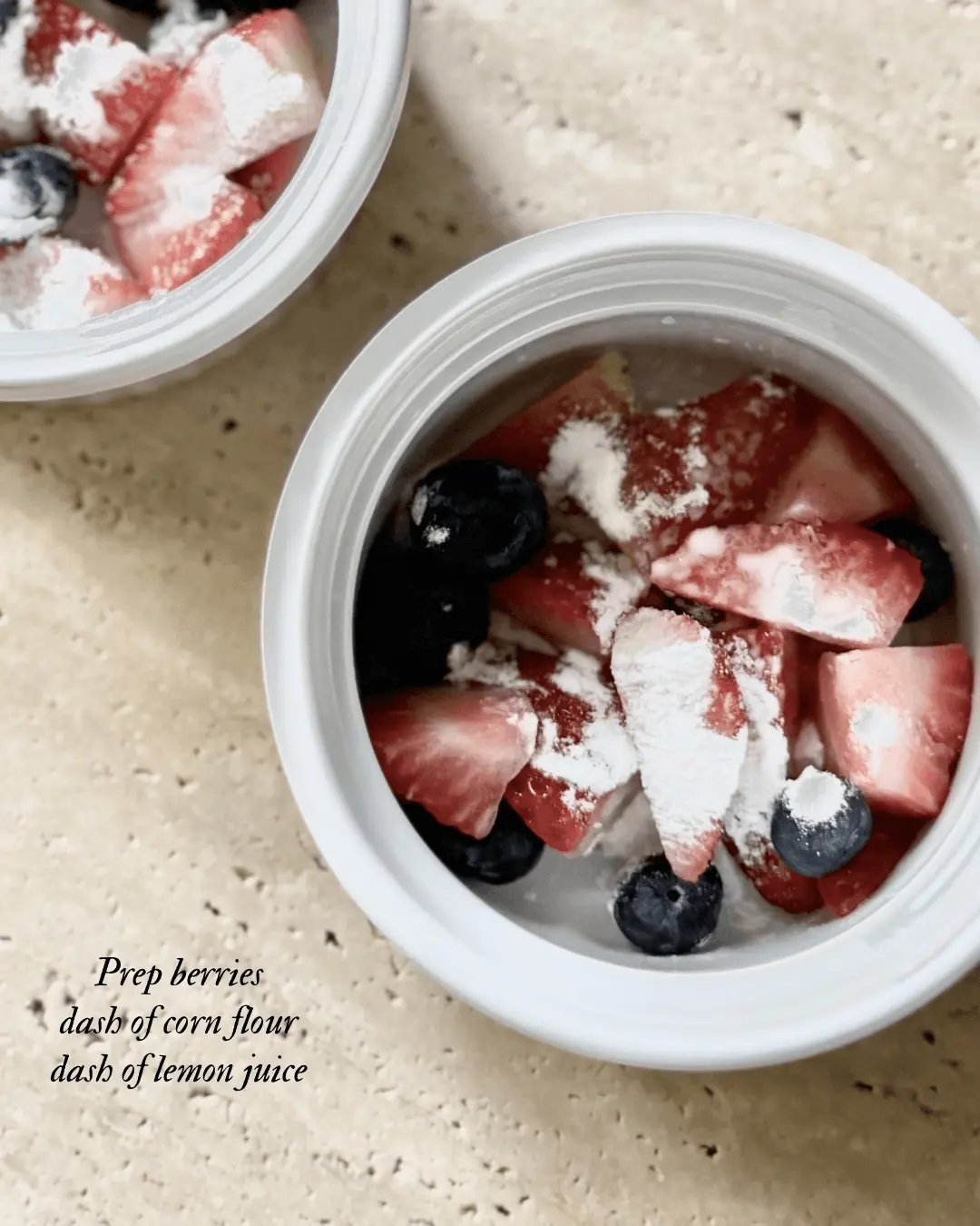 Preparing berries with cornflour and lemon juice for homemade berry crumble