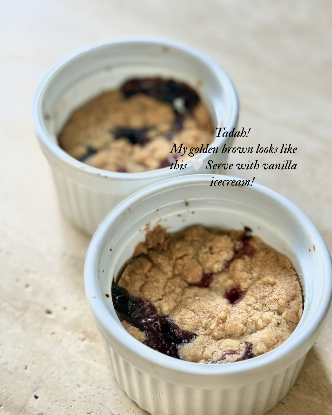 Golden brown berry crumble baked in ramekins