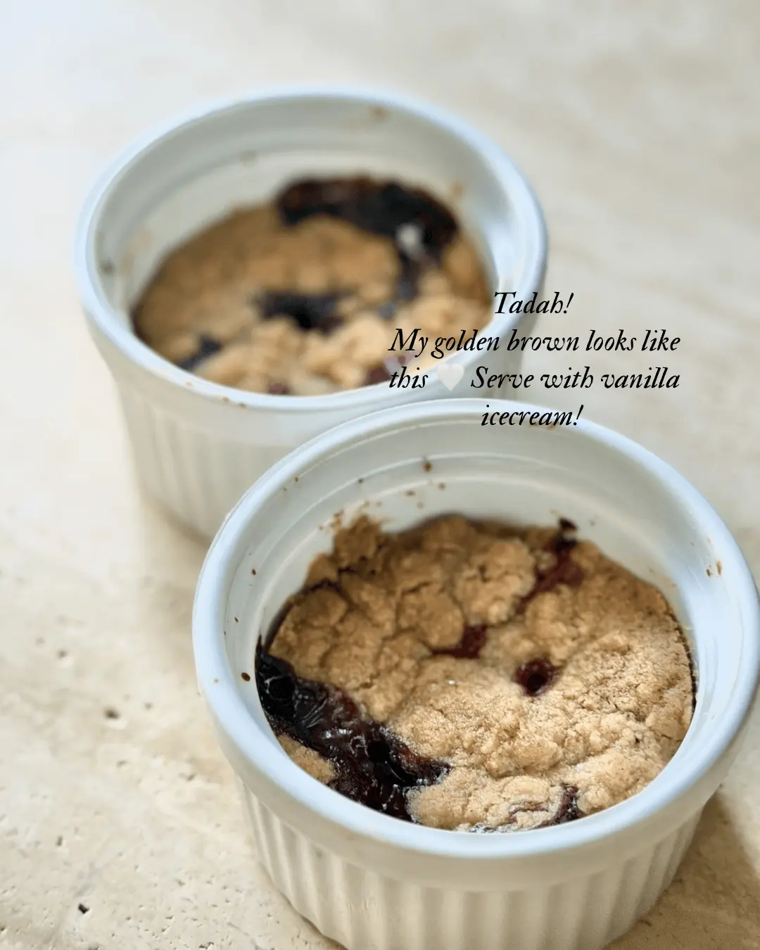 Golden brown berry crumble baked in ramekins