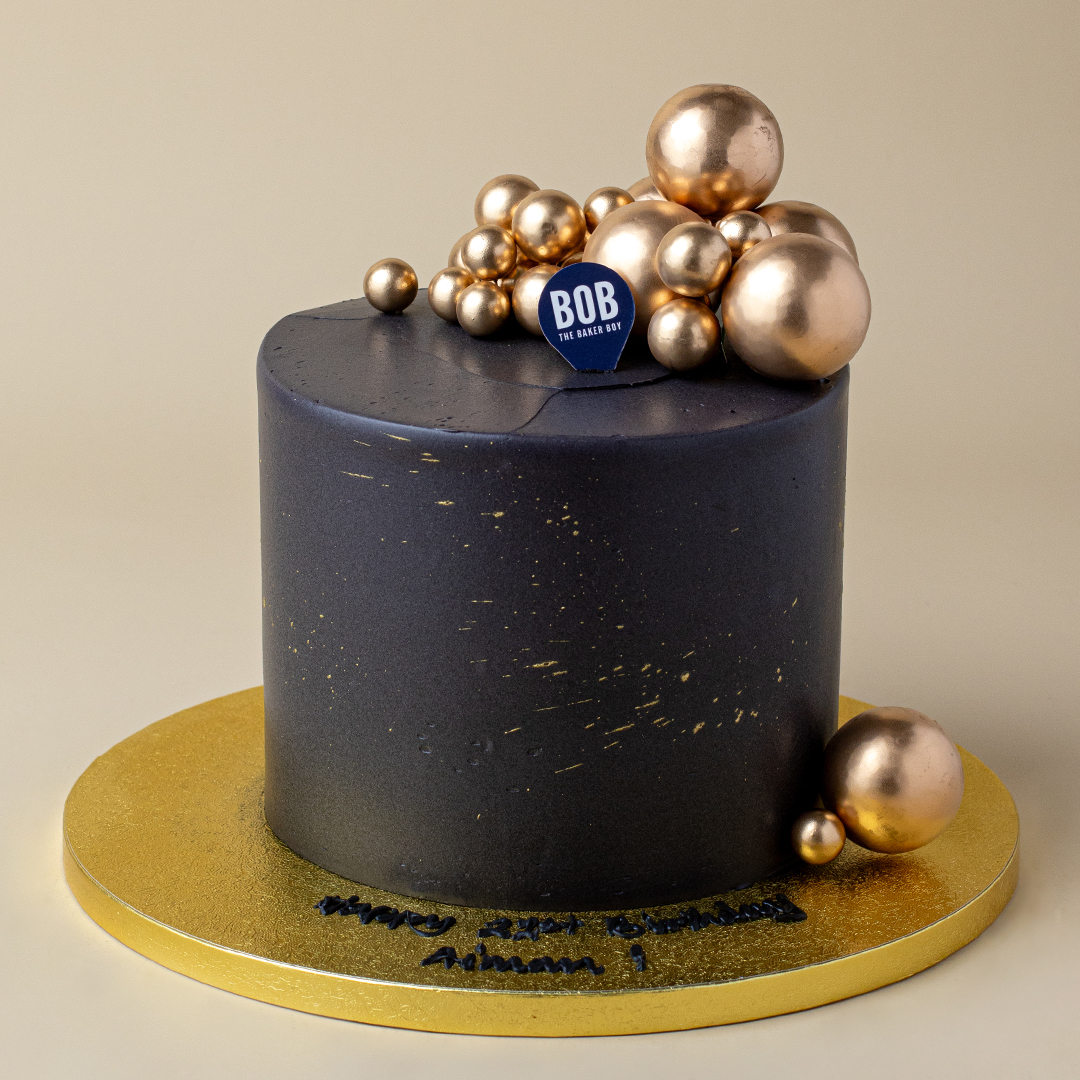 Classic Black and Gold Cake with Gold Ornaments