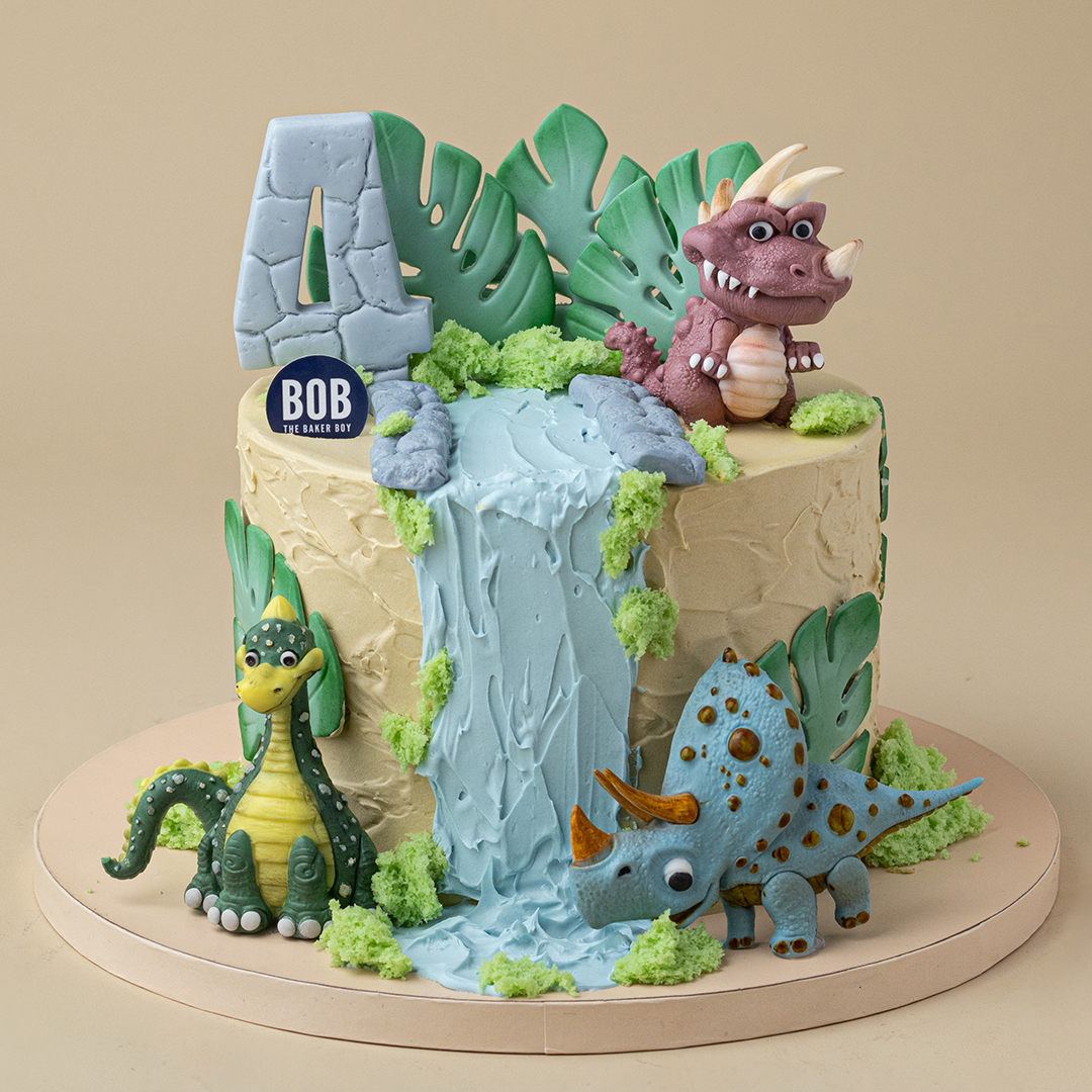 Cute Dinosaurs on Waterfall with Monstera Leaves Cake