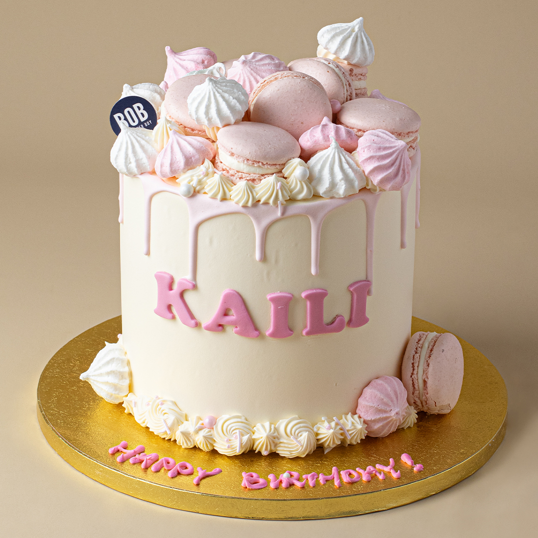 Dainty Pink Drip Cake with Macarons and Meringue