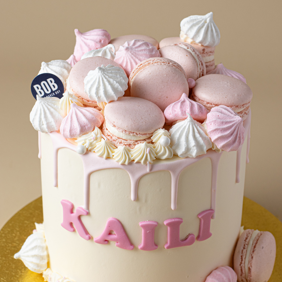 Dainty Pink Drip Cake with Macarons and Meringue