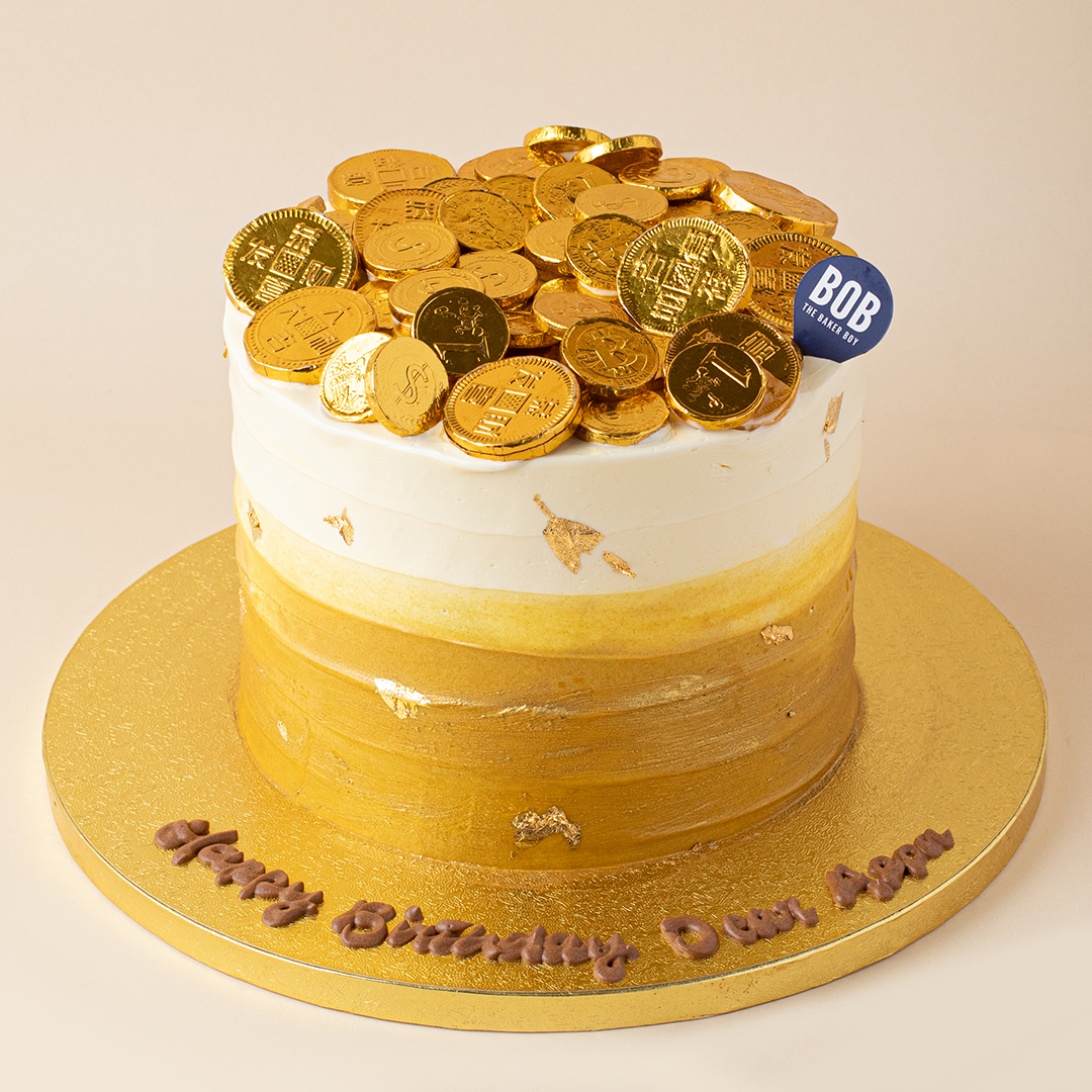 Gold Ombre Cake with Gold Bars and Coins