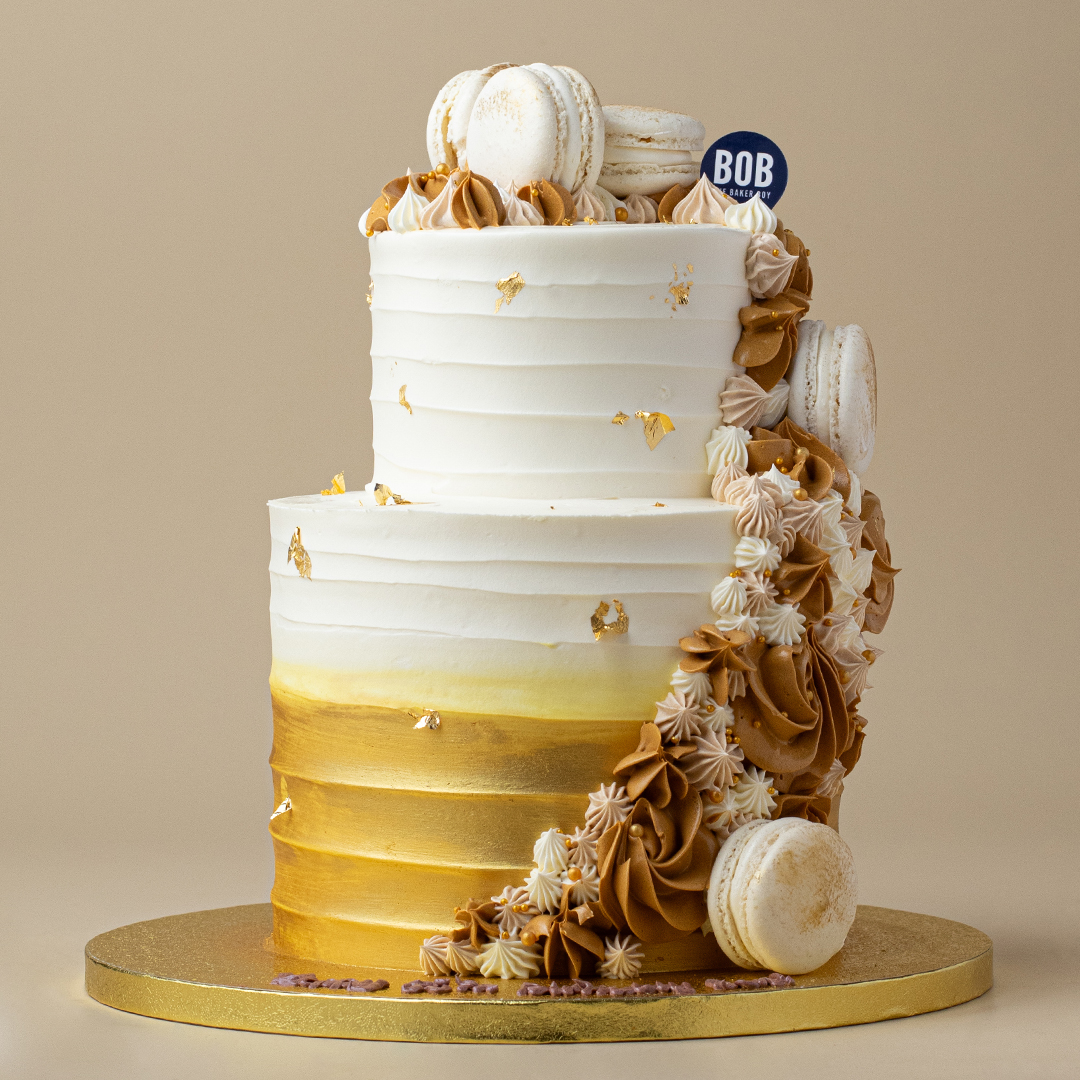Gold Ombre Cake with Piped Cream and Macarons