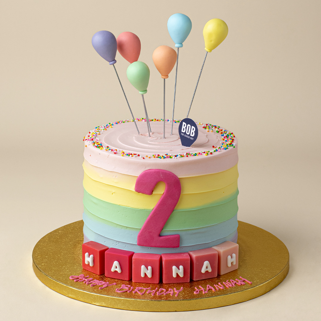 Pastel Rainbow Swirls with Balloons and Name Cubes