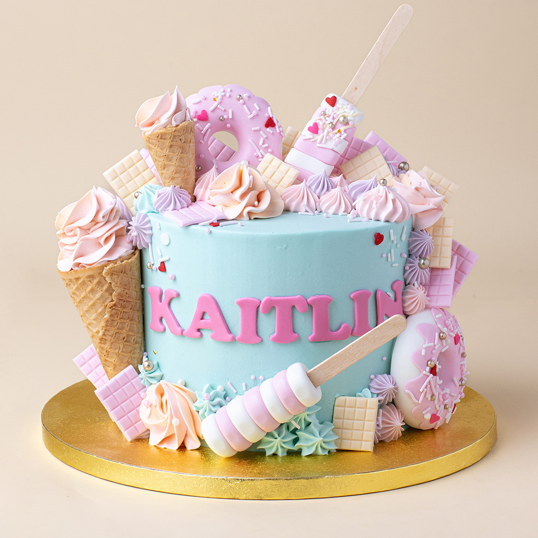 Pastel Turquoise Candyland Cake with Rainbow Lollies