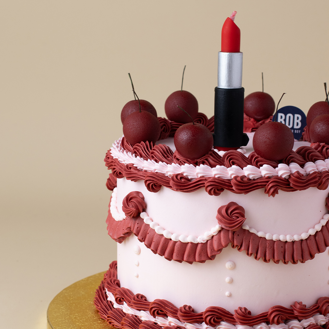Vintage Style Pink and Cherry Red Cake with Lipstick Candle