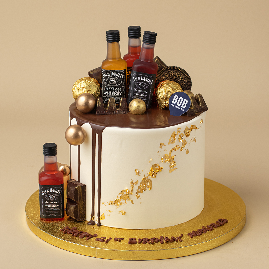 Whiskey Liquor Cake with Gold Ornaments and Drip